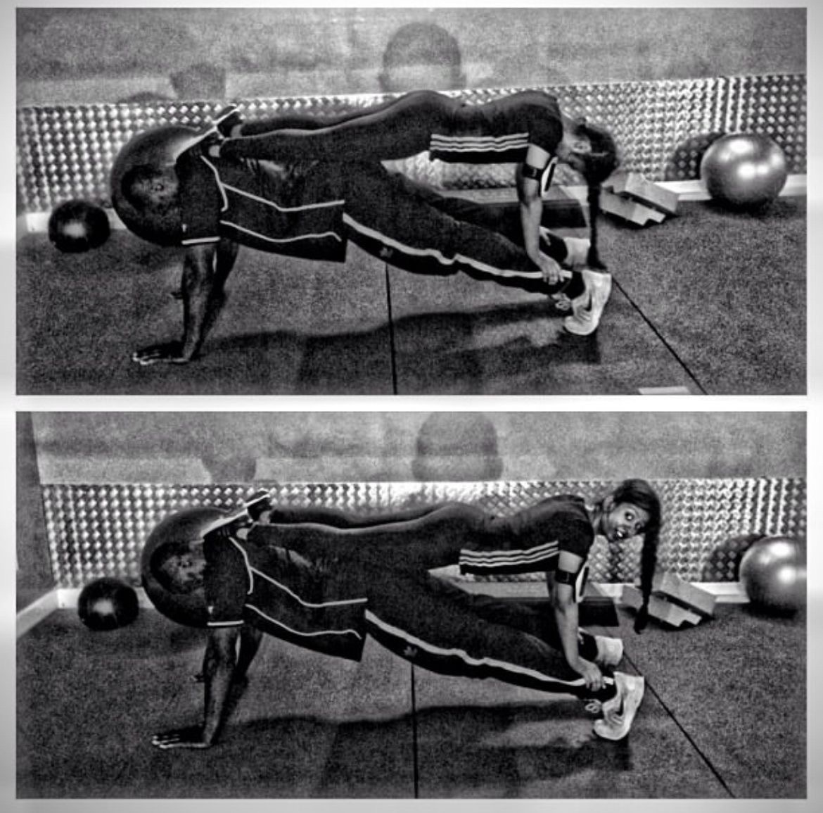 Coach Spartan spotting a female client during a plank, coaching her through proper form